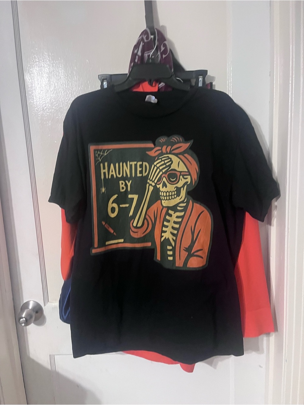 Haunted By 6-7 Skeleton Graphic Tee - Black & Orange